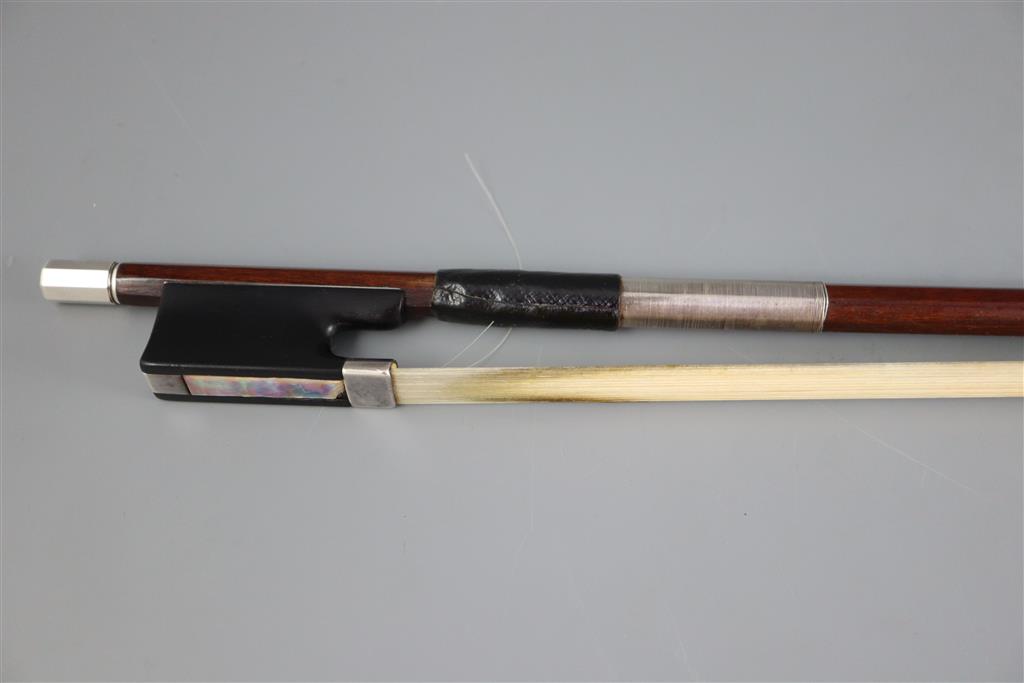 A late 19th/early 20th century silver mounted bow, unmarked, 74cm long